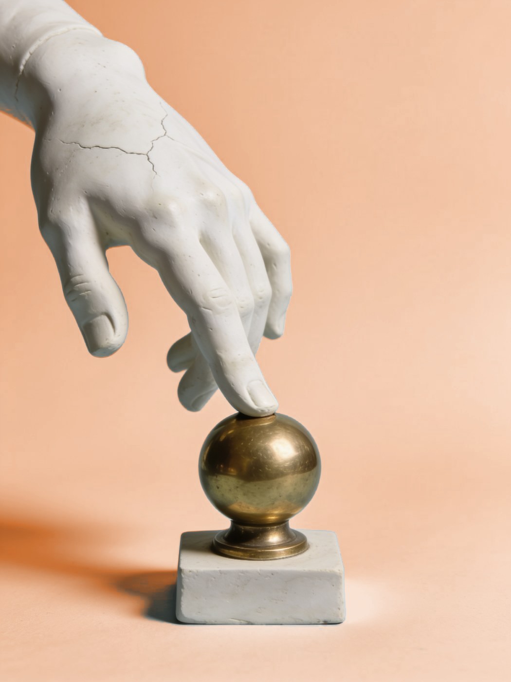 Conversion-focused web design: plaster hand pressing a large brass button